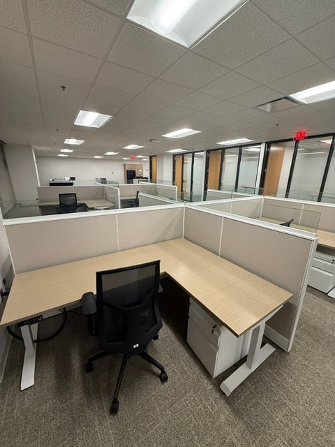 Height-adjustable workstations with mesh task chairs